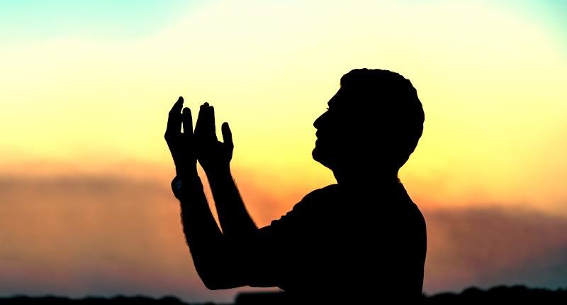 silhouette-of-man-praying-at-sunset-shutterstock-800x430